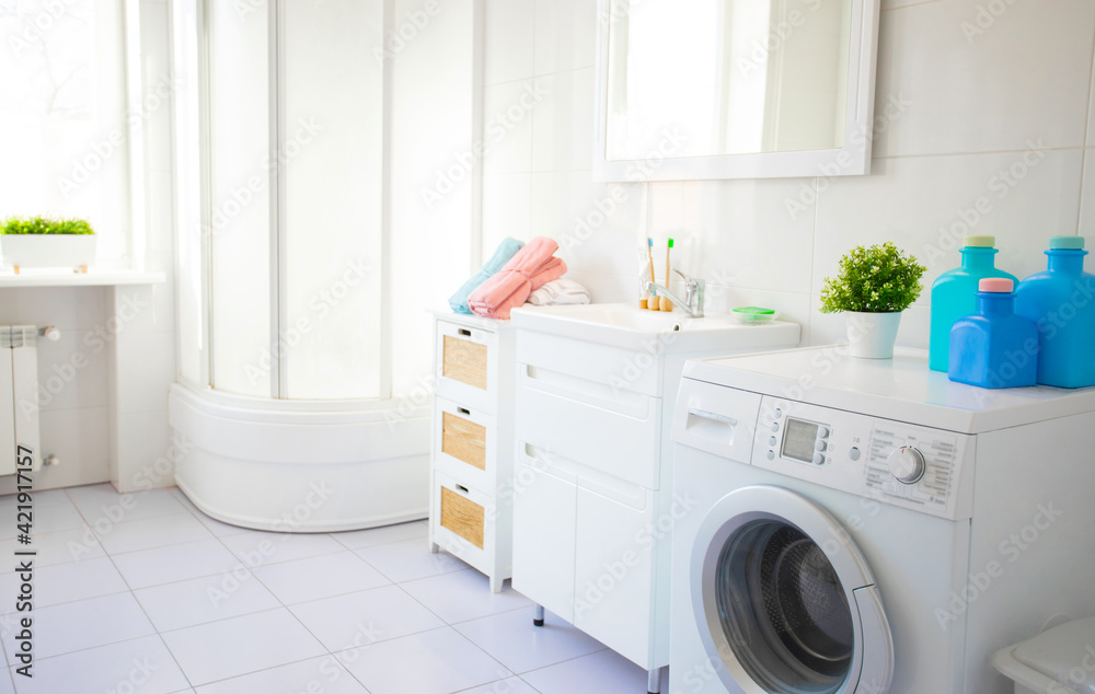 Wonderful design idea for domestic stylish bathroom interior with washing machine in light tones Wonderful design idea for domestic stylish bathroom interior with washing machine in light tones