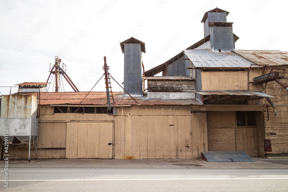 Old Abandoned Warehouse Facility Exterior with Corrugated Siding Old Abandoned Warehouse Facility Exterior with Corrugated Siding