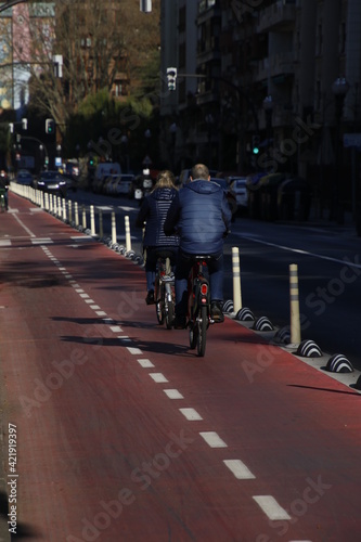 Riding a bike in the city © Laiotz