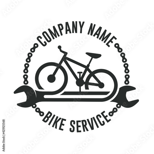 illustration of a mountain bike and a spanner, icon for bicycle repair services.