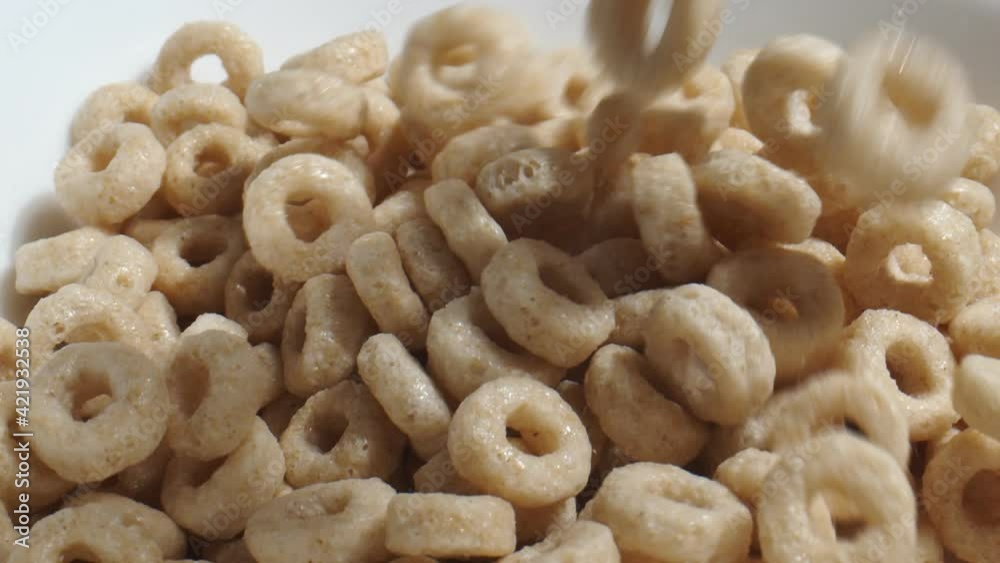 Generic breakfast cereal falling in slow motion into a bowl. Generic breakfast cereal falling in slow motion into a bowl.