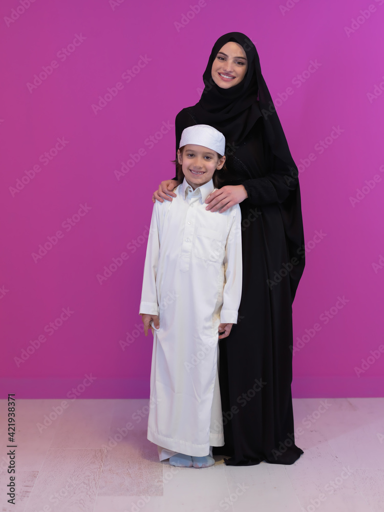 young arabian mother and son wearing traditional clothes