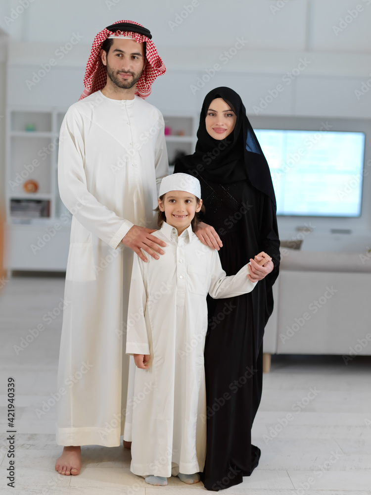 young arabian muslim family wearing traditional clothes