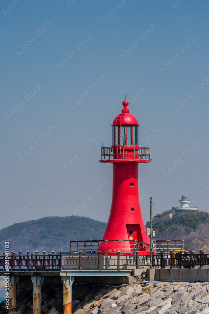 Red lighthouse on pier in Pyeongtaek, South Korea.