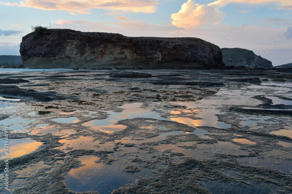 Early morning landscape in Tanjung Aan, Lombok, Indonesia with beautiful sky reflection on low tide beach. Early morning landscape in Tanjung Aan, Lombok, Indonesia with beautiful sky reflection on low tide beach.