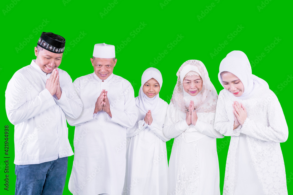 Muslim family showing a greeting hands on studio Muslim family showing a greeting hands on studio