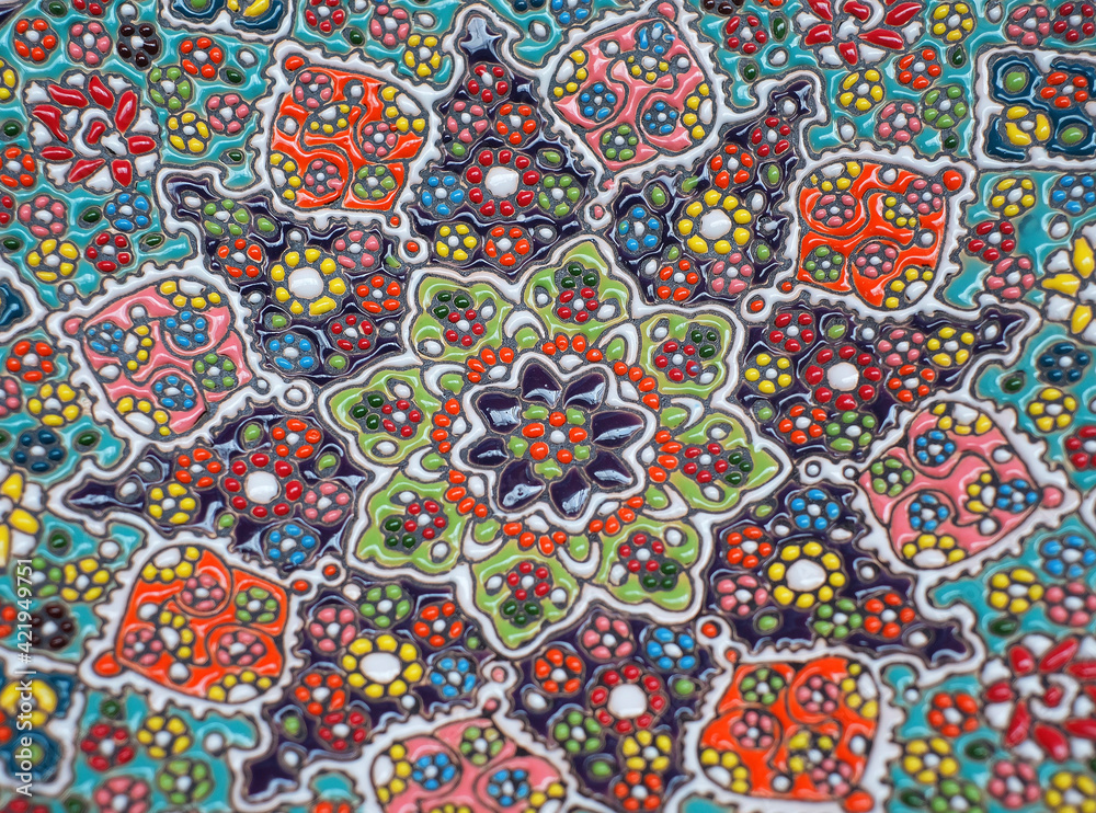 Pattern of an Iranian clay plate decorated with small pieces of colorful ceramics Pattern of an Iranian clay plate decorated with small pieces of colorful ceramics