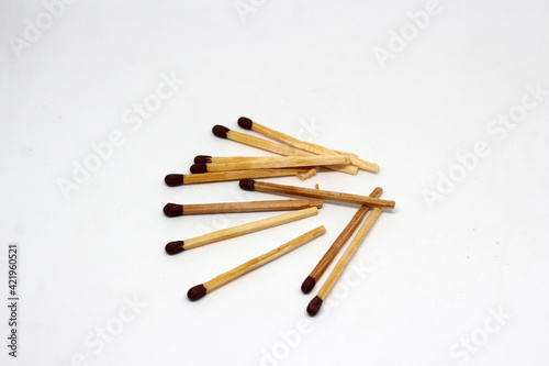 Wooden match isolated on white background.