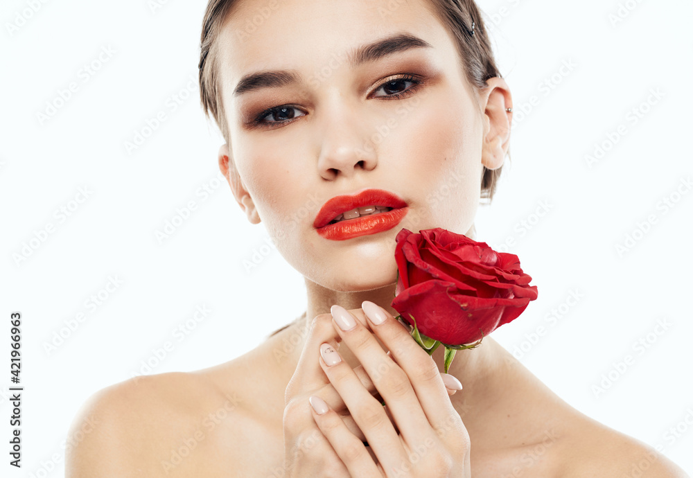 Attractive woman model with bared shoulders and a flower emotion charm Attractive woman model with bared shoulders and a flower emotion charm