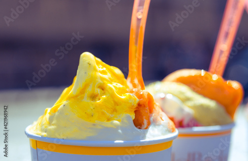 Photography gelato italian ice cream on the street in rome mango pistachio ice cream