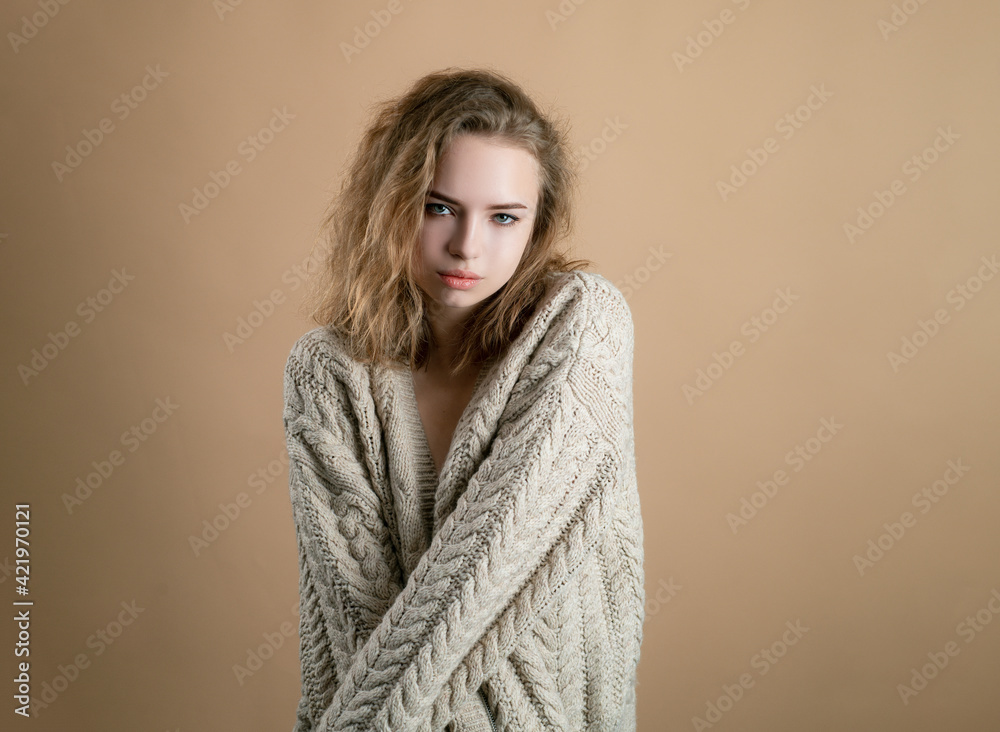 Cozy fashion. Woman in sweater. Beautiful lady wearing warm woolen sweater. Cozy fashion. Woman in sweater. Beautiful lady wearing warm woolen sweater.