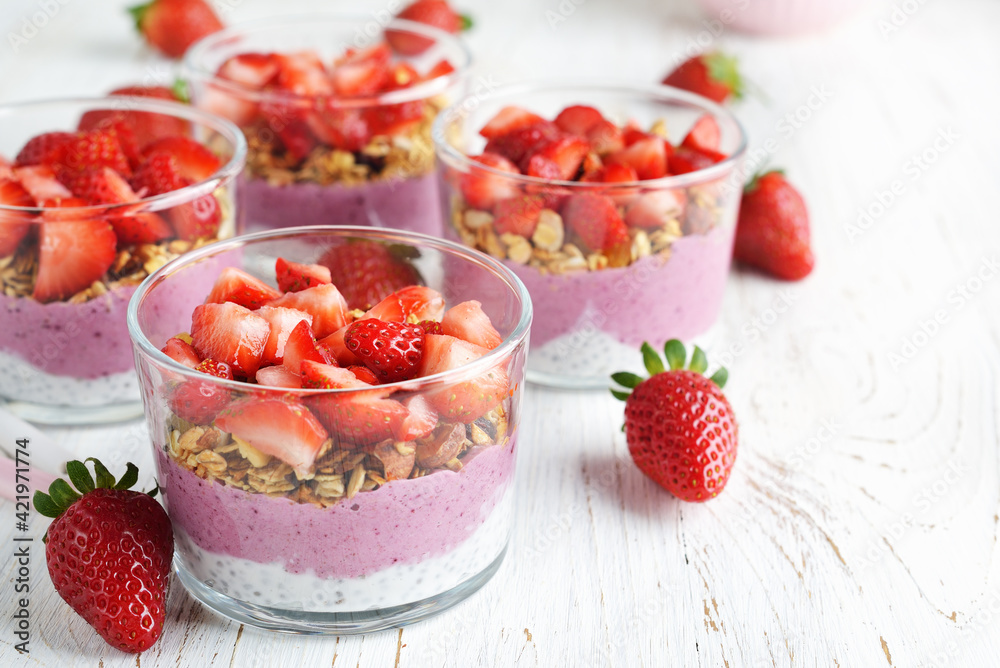 Dessert with chia pudding, granola and strawberries Dessert with chia pudding, granola and strawberries