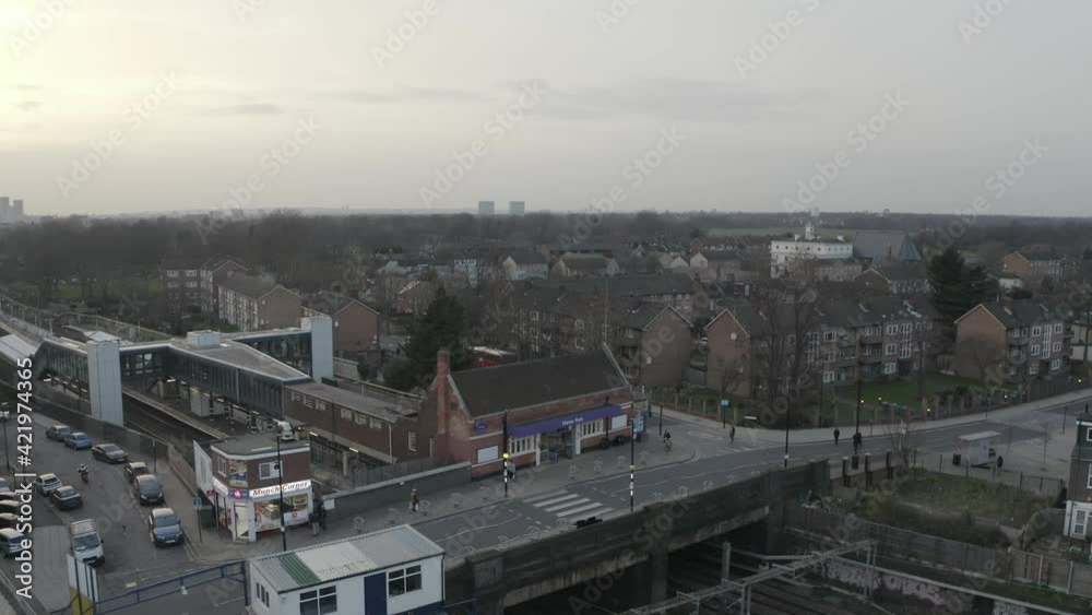 DRONE FLYING AROUND A TRAIN STATION AT SUNSET DRONE FLYING AROUND A TRAIN STATION AT SUNSET