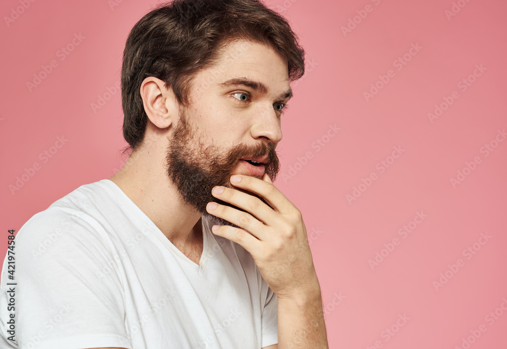 Energetic man on pink background fun cropped view Energetic man on pink background fun cropped view