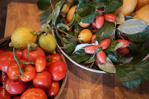 tomatoes, lemon, Indian ivy-rue in kitchen photo