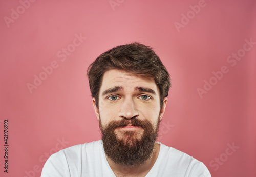 Male cropped view portrait of brunet bushy beard white t-shirt © SHOTPRIME STUDIO