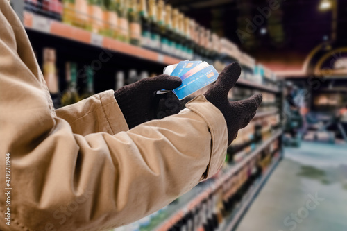Man doing purchases in grocery shop with credit card