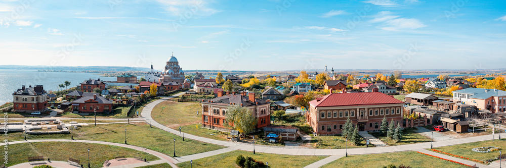 A wide panorama of Sviyazhsk. View of the Russian village with Orthodox churches and the Volga River.