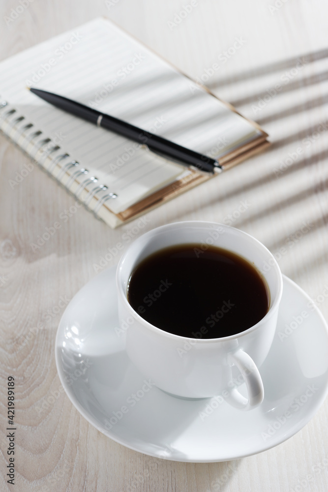 Coffee and notepad with pen Coffee and notepad with pen