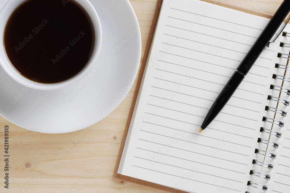 Coffee and notepad with pen Coffee and notepad with pen