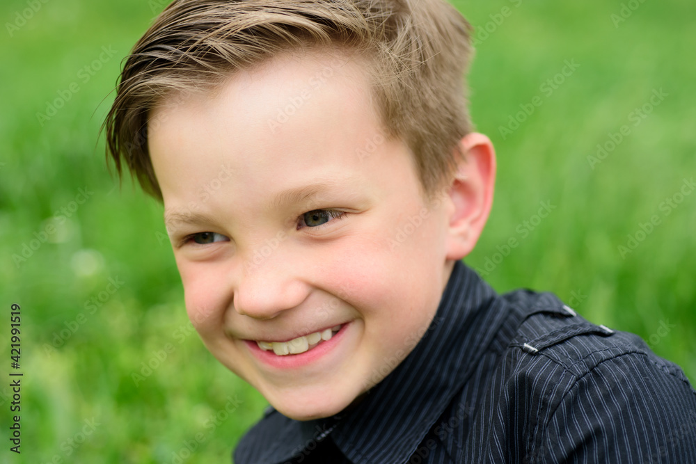 Handsome boy in black t-shirt outdoor. Happy child emotion expression. Emotional child portrait. Handsome boy in black t-shirt outdoor. Happy child emotion expression. Emotional child portrait.