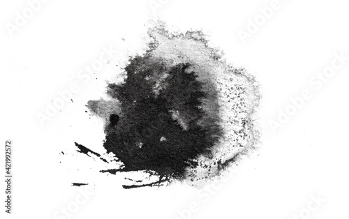 abstract black splashes on white watercolor paper. monochrome image.