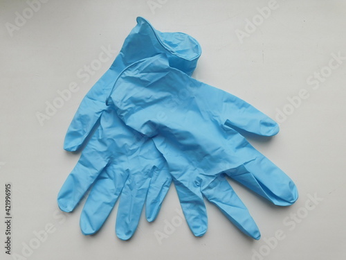 Blue nitrile medical gloves on white table