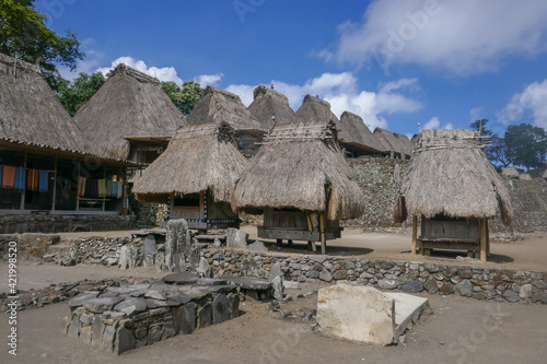 View of Bena traditional village of Ngada tribe or people with graves and bhaga huts, near Bajawa on Flores island, East Nusa Tenggara, Indonesia photo