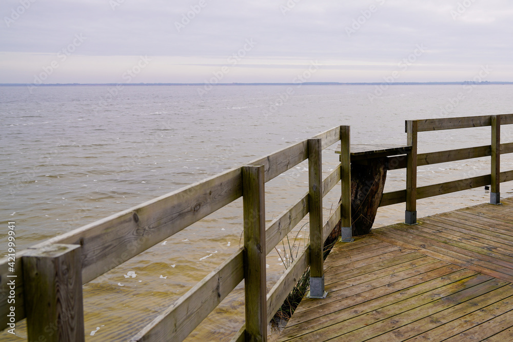 wooden access to sandy beach Maubuisson Carcans lake water in southwest france wooden access to sandy beach Maubuisson Carcans lake water in southwest france