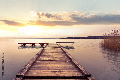 Fototapeta Naklejka Na Ścianę i Meble -  Sunset at over the pier at Lake Balaton Hungary