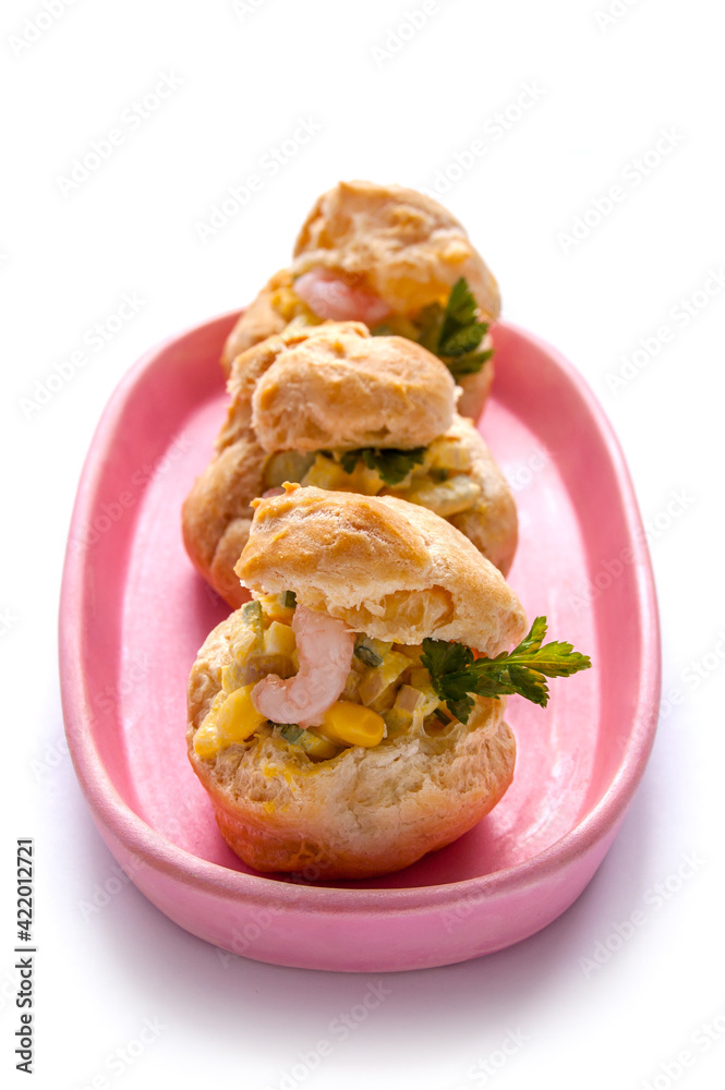 Shrimp Salad Profiterole. Profiteroles with a salad with shrimp on the white Shrimp Salad Profiterole. Profiteroles with a salad with shrimp on the white
