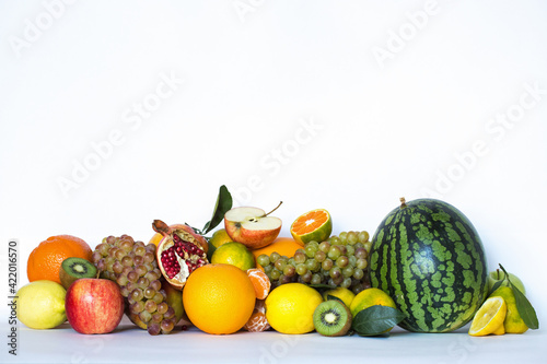 Healthy fruits on a white.