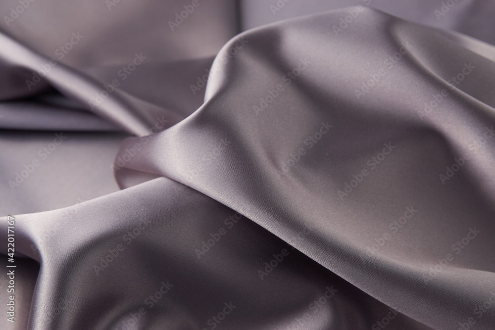 Gray silk fabric background, top view, close-up Gray silk fabric background, top view, close-up