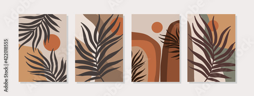 Abstract landscape set with geometric shapes, sun, tropical leaves in mid century modern style photo