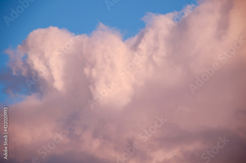 beautiful evening cloudscape with big fluffy cumulus clouds