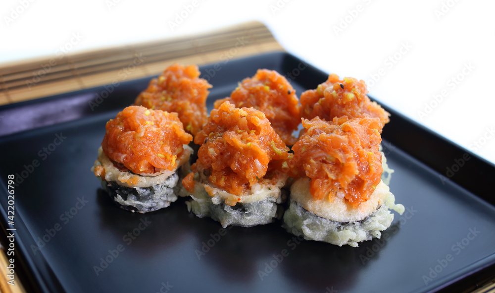 appetizing fish tartare sushi served nicely on a black plate