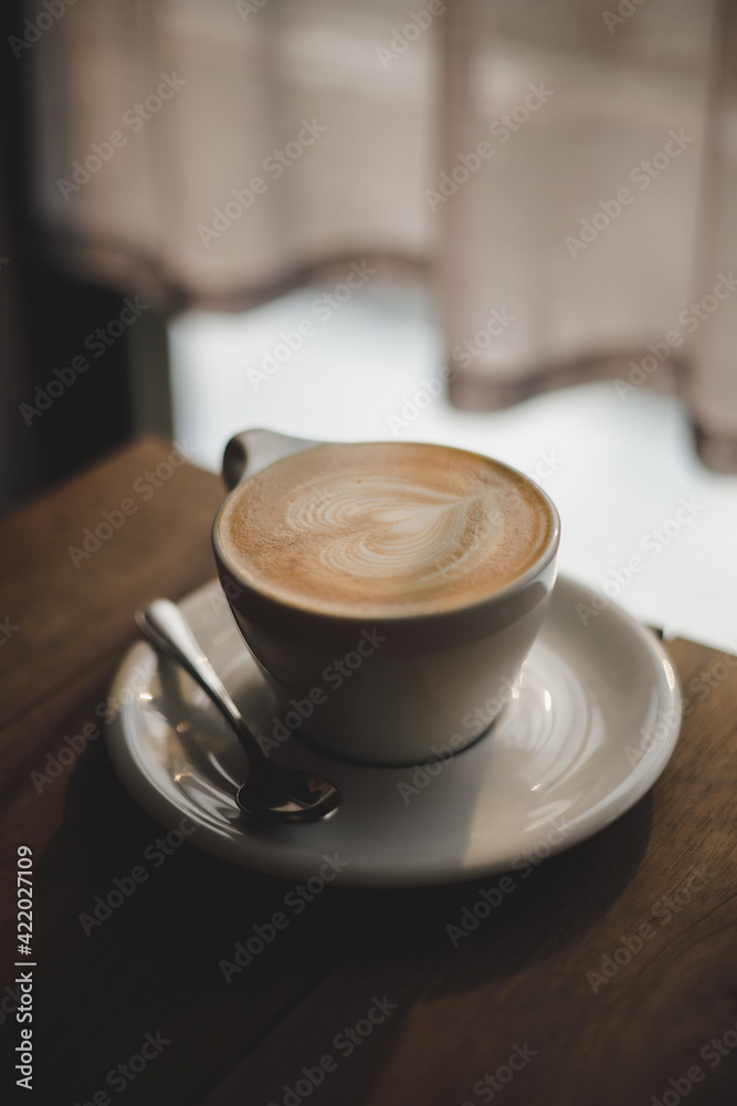 women enjoy drinking coffee at a cafe while having coffee Cup of hot cappucino women enjoy drinking coffee at a cafe while having coffee Cup of hot cappucino