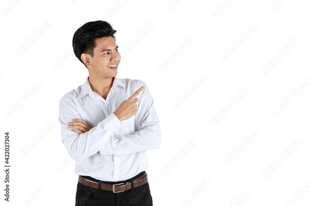 Portrait studio shot of a young friendly face and handsome Asian man standing and pose to camera with positive gesture isolated on white background and pointing finger to copy space on side of him. Portrait studio shot of a young friendly face and handsome Asian man standing and pose to camera with positive gesture isolated on white background and pointing finger to copy space on side of him.