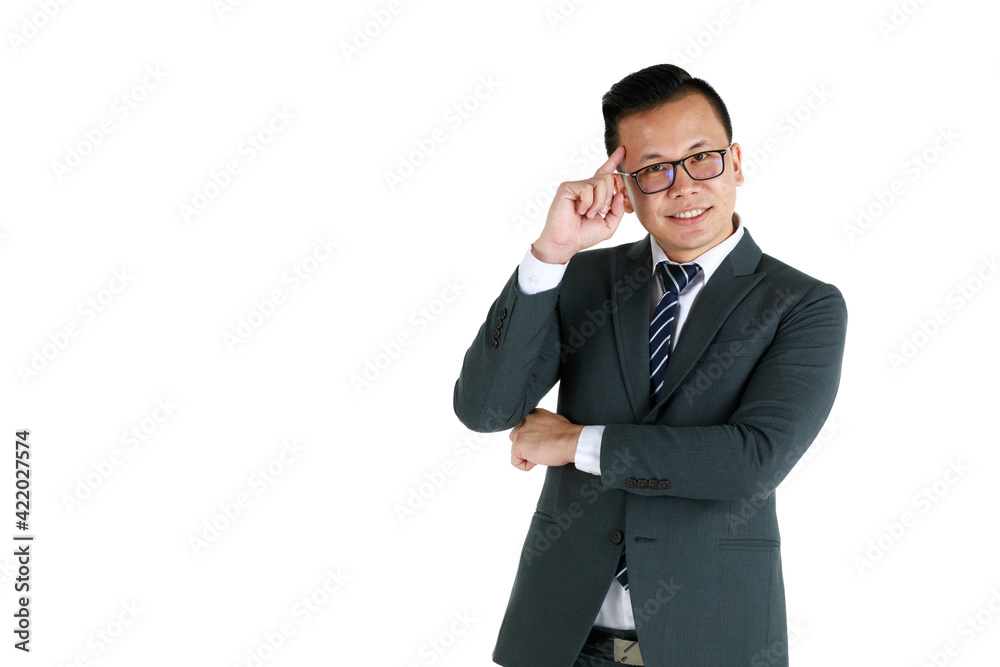 Young and handsome businessman executive look, wearing dark gray suit and eyeglasses standing with friendly face and self-confidence with hand touch head in thinking gesture Young and handsome businessman executive look, wearing dark gray suit and eyeglasses standing with friendly face and self-confidence with hand touch head in thinking gesture
