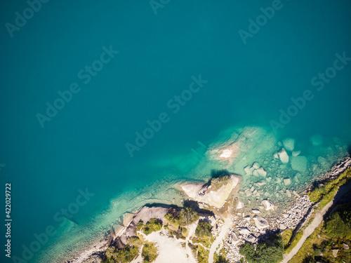 Bird s eye view of a swiss lake with blue water and shoreline