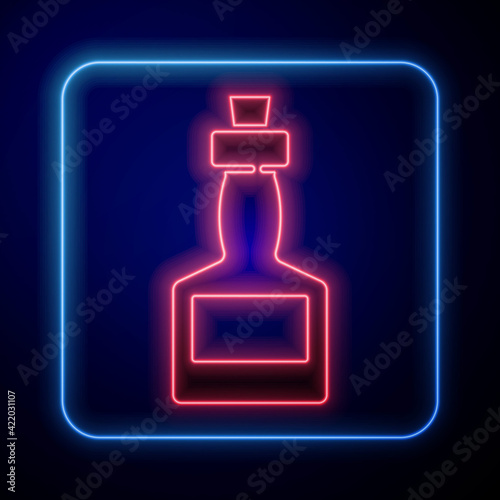 Glowing neon Tabasco sauce icon isolated on blue background. Chili cayenne spicy pepper sauce. Vector