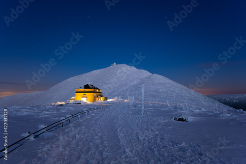 amazing view of Sniezka peak at dusk in winter in the Karkonosze Mountains in Poland
