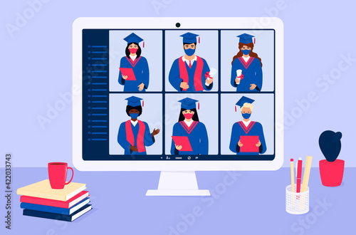 A group of multiethnic graduates in gowns and mortarboards celebrate graduation during coronavirus quarantine. Virtual online ceremony on a laptop monitor. Diverse students wearing protective masks