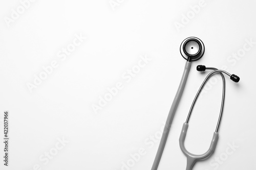 Stethoscope on white background  top view. Space for text