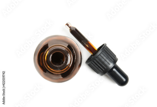 Obraz na plátně Bottle of medical iodine and dropper on white background, top view
