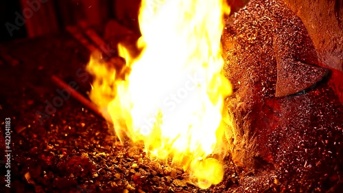 blacksmith. Blacksmithing Workshop.Metalworking.  Blacksmith is using hammer to forge metal