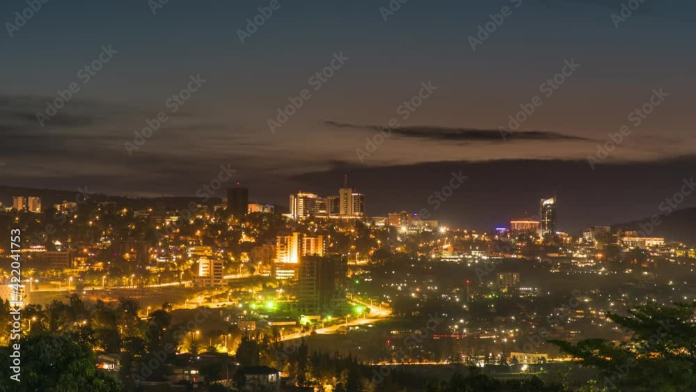 Timelapse video of Kigali city centre skyline and surrounding areas showing a darkening sky at night. Rwanda