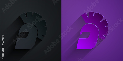 Paper cut Greek helmet icon isolated on black on purple background. Antiques helmet for head protection soldiers with a crest of feathers or horsehair. Paper art style. Vector