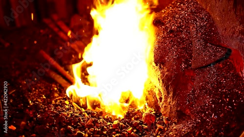blacksmith. Blacksmithing Workshop.Metalworking.  Blacksmith is using hammer to forge metal