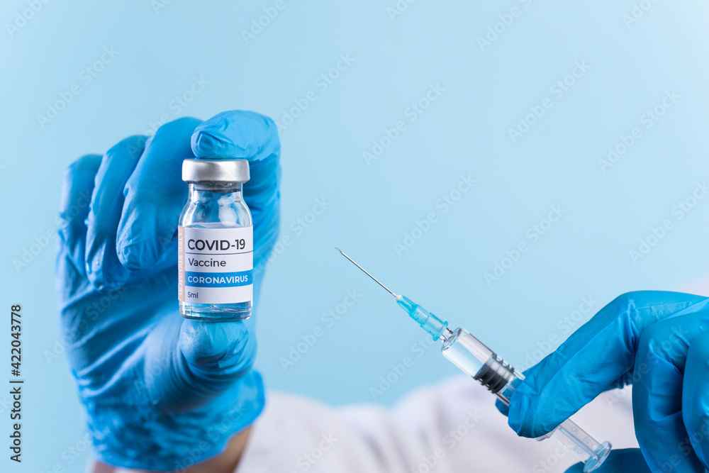 Doctor's hands preparing the coronavirus COVID-19 vaccine